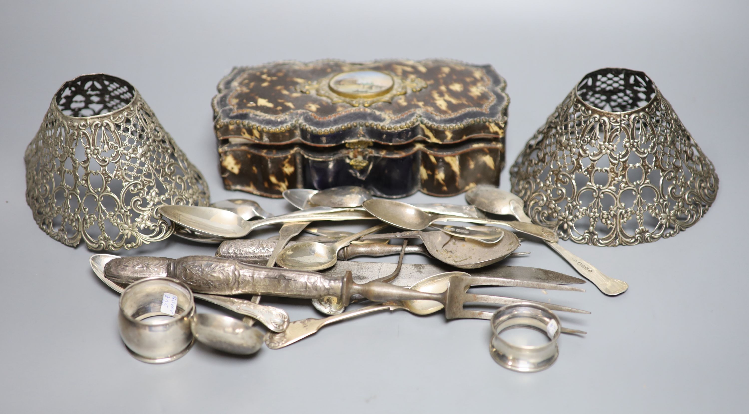 A group of assorted silver flatware and other items, including teaspoons, napkin ring, pierced Gorham lamp shades, carving implements and a Palais Royale faux tortoiseshell casket